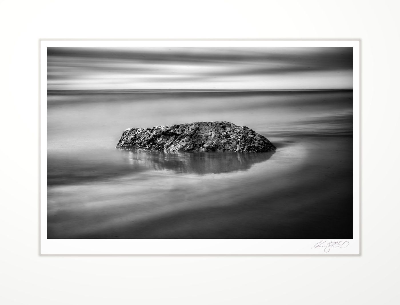 Solitary rock on a Lake Michigan shore