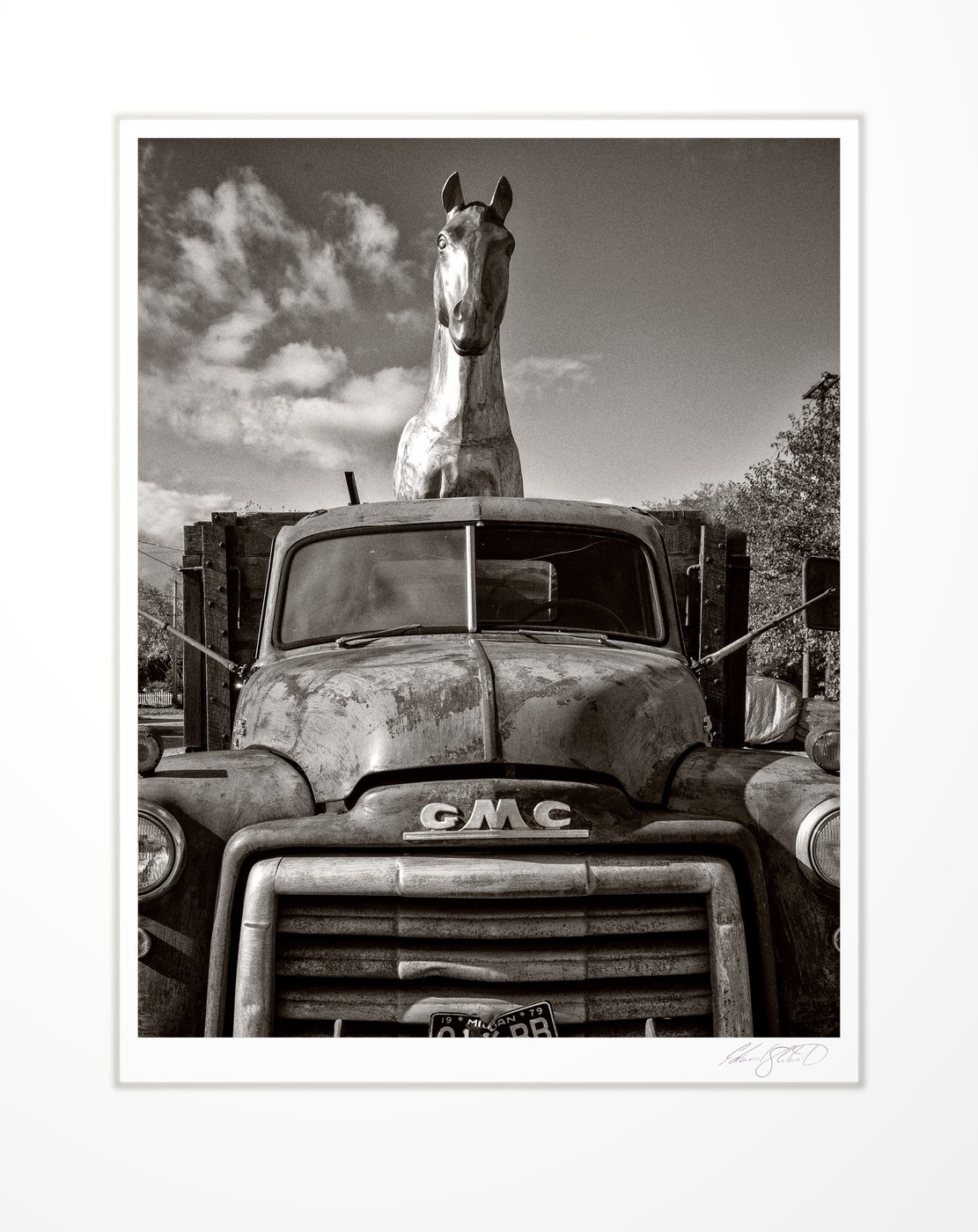 Vintage GMC truck with horse figure